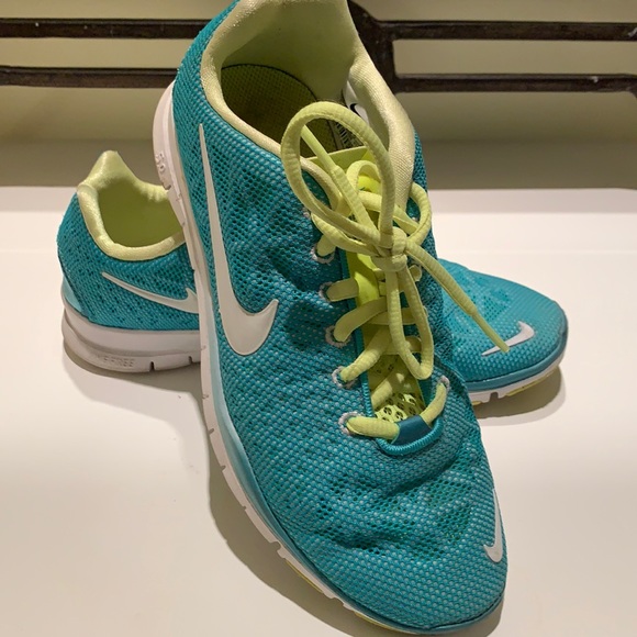 Nike Free women’s athletic shoes size US 6. Turquoise and yellow